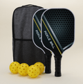 A pickleball set featuring four yellow hybrid pickleballs, two paddles, and a carrying bag, arranged neatly on a surface.