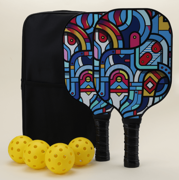 A pickleball set featuring two paddles with modern, artistic patterns in bold, vibrant colors, each with a black paddle cover, four yellow pickleballs, and a black pickleball carry bag, all neatly arranged to highlight the unique and stylish design.