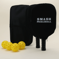 A pickleball set featuring two paddles with modern, artistic patterns in bold, vibrant colors, each with a branded black paddle cover, four yellow pickleballs, and a black pickleball carry bag, all neatly arranged to highlight the unique and stylish design.