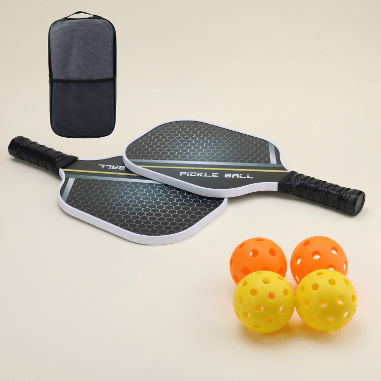 A set including two pickleball paddles, two yellow hybrid pickleballs, two orange hybrid pickleballs, and a carrying bag, neatly arranged.