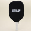 A single pickleball paddle with a branded black cover on, highlighting its sleek and protected design.