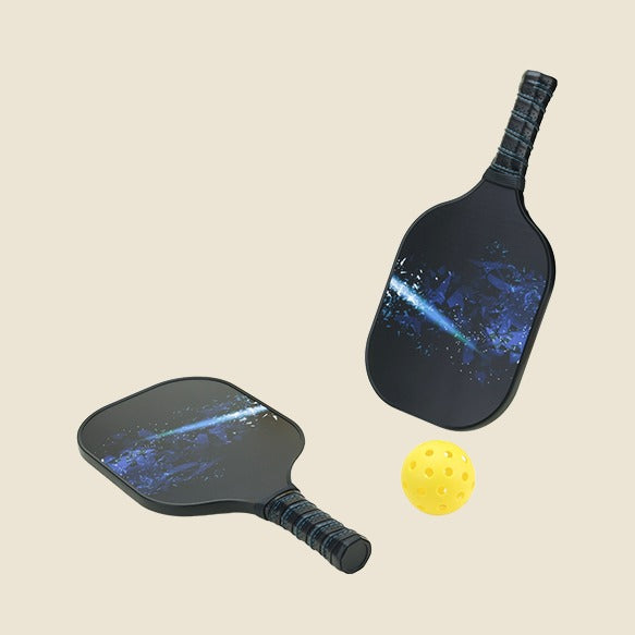  "Two pickleball paddles featuring a stunning galaxy design, paired with a yellow pickleball ball. Ideal for pickleball players looking for stylish and functional sports equipment."