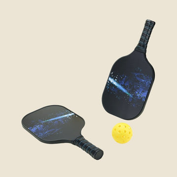  "Two pickleball paddles featuring a stunning galaxy design, paired with a yellow pickleball ball. Ideal for pickleball players looking for stylish and functional sports equipment."