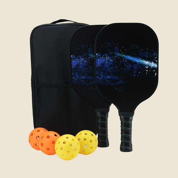  "Two pickleball paddles with a galaxy-themed design, accompanied by three balls (yellow and orange) and a convenient black carrying bag for easy transport. Perfect for pickleball players looking for a complete and stylish set."