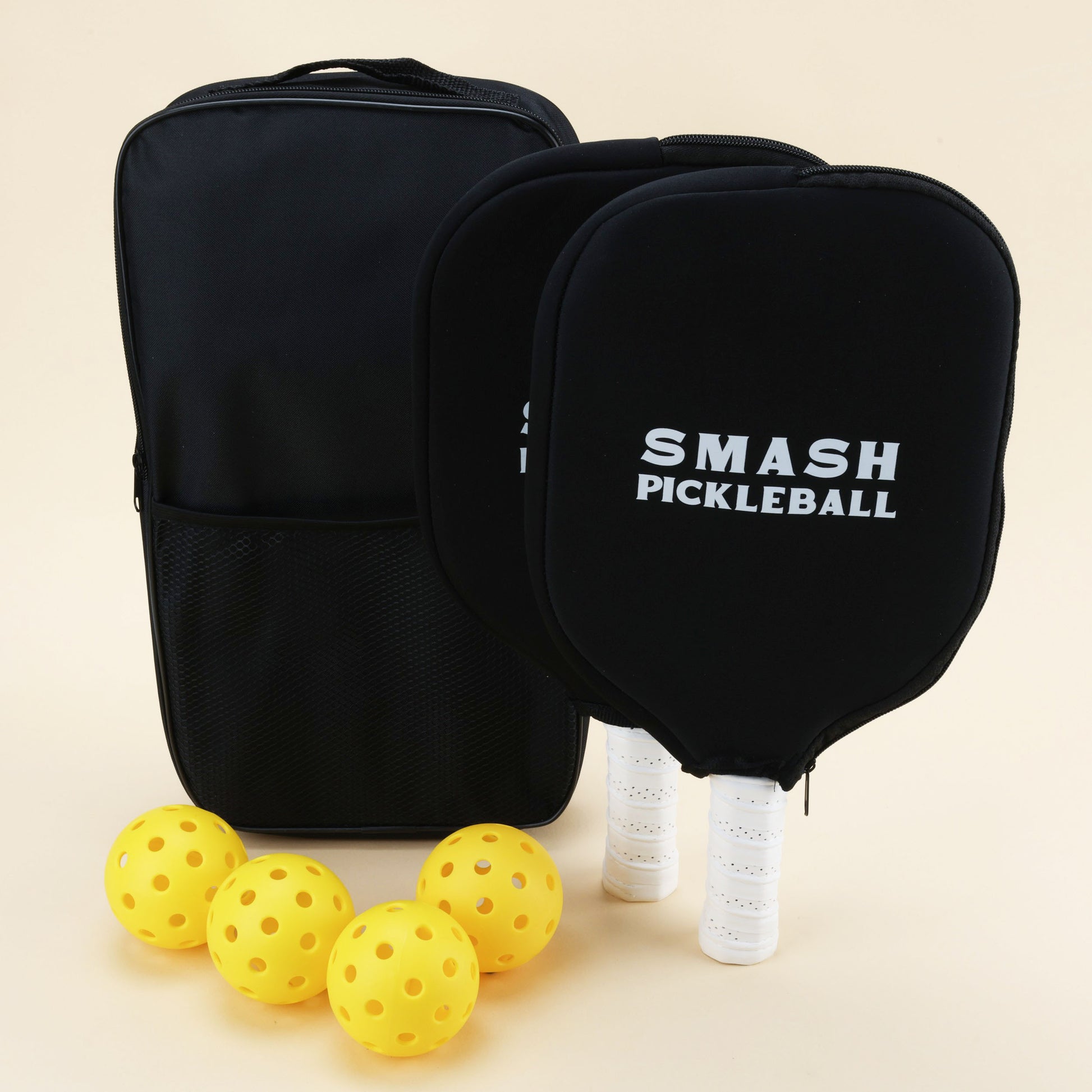 Pickleball starter kit with 2 paddles, 4 durable balls, and a carry bag, perfect for fun games indoors or outdoors.