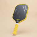 Image of the T700 carbon fiber pickleball paddle with a striking yellow grip and sleek black surface. Designed for pro-level performance, this paddle offers a balanced combination of power, control, and durability for competitive players.