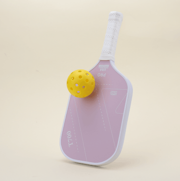 T700 pickleball paddle with an elegant and modern pink design, ideal for younger players and families. Perfectly complementing the paddle’s design, along with a yellow pickleball, offering everything you need to start playing right out of the box.