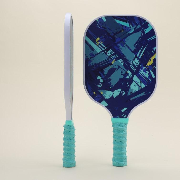 Two pickleball paddles, one shown from the front view and the other from the side view, featuring a unique blue abstract pattern full of modern flair and energy.