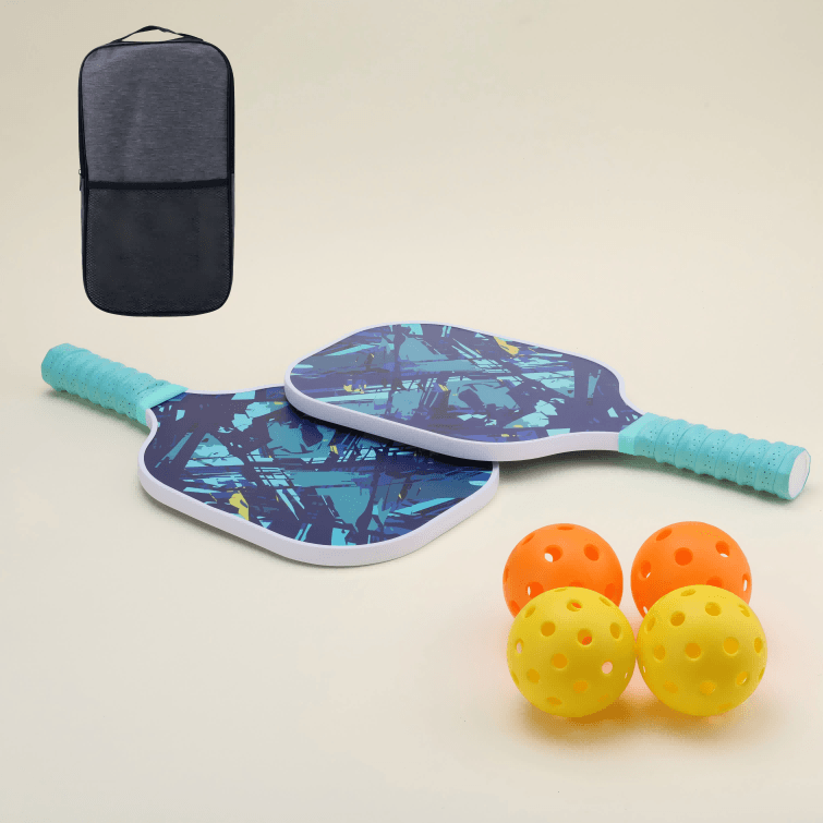 Two yellow hybrid pickleballs, two orange hybrid pickleballs, two paddles featuring a unique blue abstract pattern, and a black carry bag, all arranged together for a vibrant and complete set.