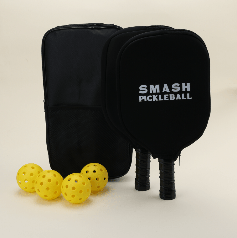 USA-approved pickleball set featuring 2 paddles, 4 yellow pickleballs, 2 black Smash Pickleball branded paddle covers, and 1 black carry bag